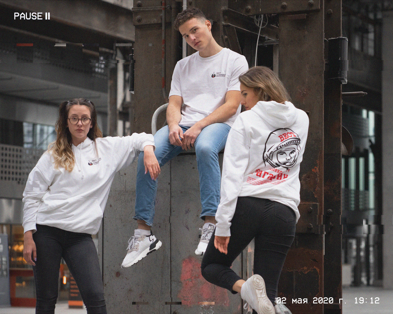 Trio: Man with BECT Gagarin shirt and two Women with BECT Gagarin hoodies